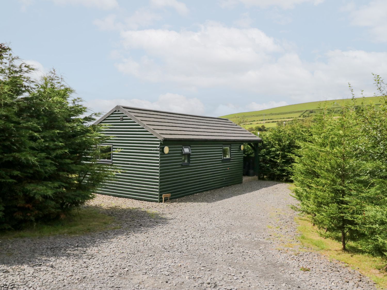 A cabin surrounded by trees at Ash Lodge Pennington near Ulverston