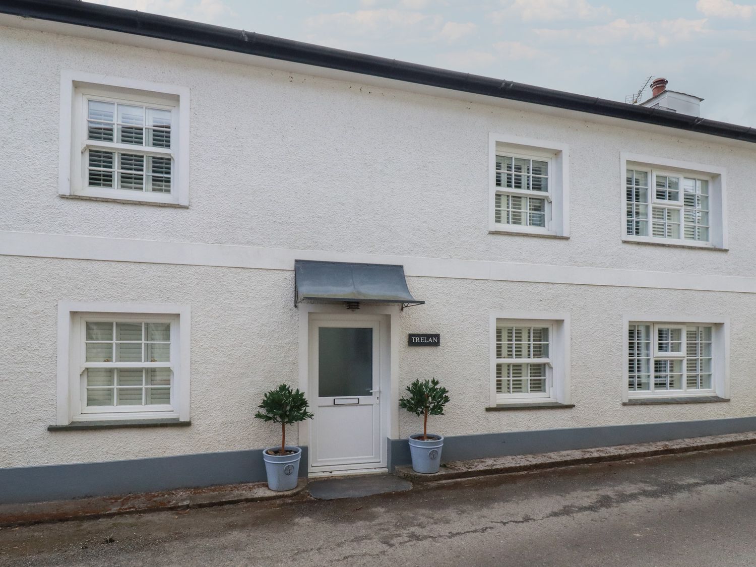 A house exterior with a door and windows at Trelan in Mevagissey