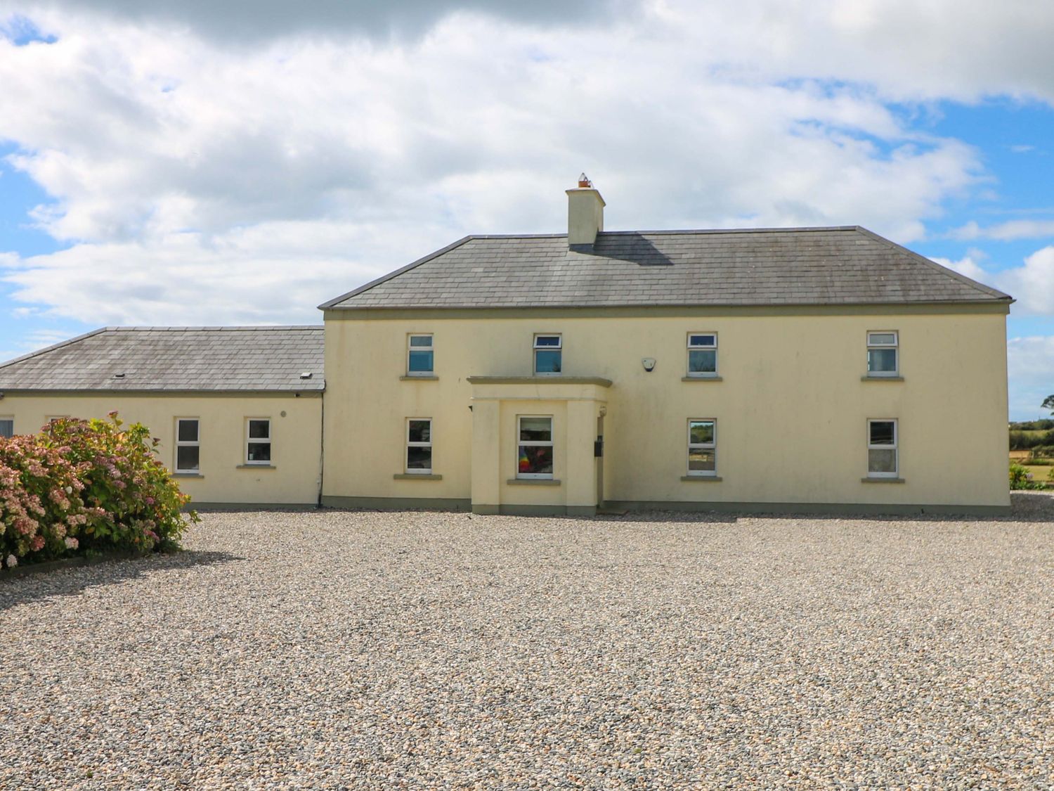 A house with windows and door at Sanderling Lodge in Tacumshane, County Wexford