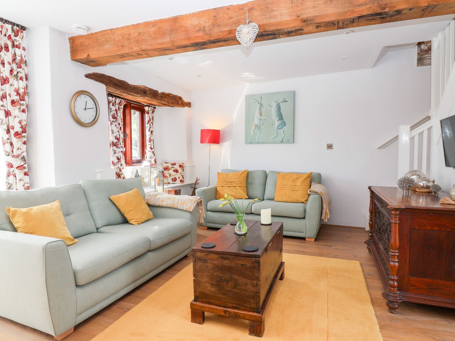 A living room with two sofas and a wooden coffee table at The Bolthole in Throwleigh near Chagford
