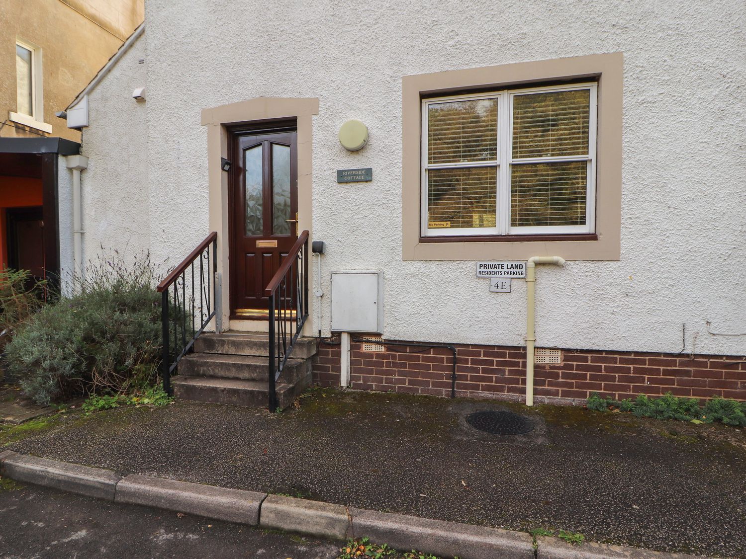 An entrance with steps and a door to Riverside Cottage Cockermouth