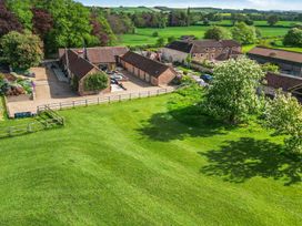 An outdoor view of buildings and fields at Sykes Lodge in Malton