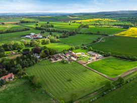 An aerial view of farmland and fields at Sykes Lodge in Malton