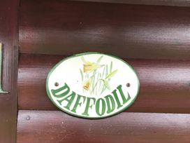 A sign with the word Daffodil and a floral design at Daffodil Lodge in Saltburn-by-the-Sea