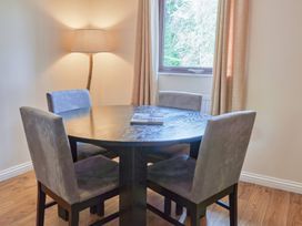 A dining room with a table and chairs at Daffodil Lodge Saltburn-by-the-Sea