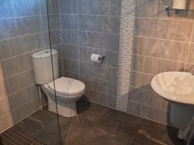 A bathroom with a toilet and wash basin at Daffodil Lodge Saltburn-by-the-Sea