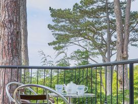 A balcony with a table and chairs at Daffodil Lodge Saltburn-by-the-Sea