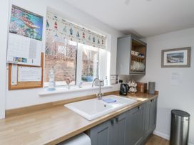A kitchen with a sink and kettle at Chapel Cottage in Filey