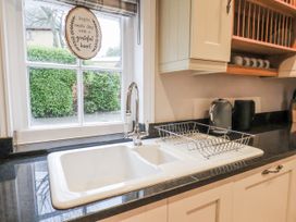 A kitchen featuring a sink and window at The Manor House in Scarborough