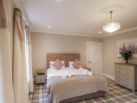 A bedroom with a bed and chest of drawers at The Manor House in Scarborough