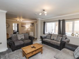 A living room with sofas and a coffee table at Tennyson House in Scarborough