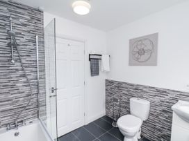 A bathroom with a bathtub and shower at Tennyson House in Scarborough