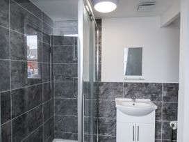 A bathroom with a shower and a sink at Tennyson House in Scarborough