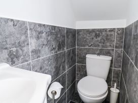 A bathroom with a toilet and sink at Tennyson House in Scarborough