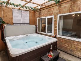 A hot tub with instructions on the wall at Tennyson House in Scarborough