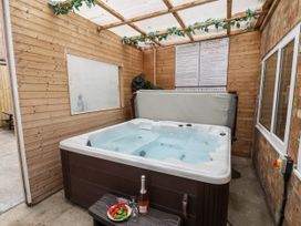 An indoor hot tub with wine and strawberries at Tennyson House in Scarborough