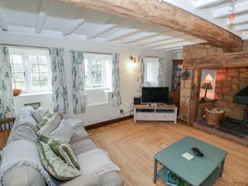 A living room with a sofa and television at Priors Mead Claydon near Cropredy