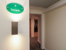 A hallway with a door and nameplate at Tornado @ Engine Shed in Whitby