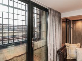 A living room with a window and curtain at Tornado @ Engine Shed in Whitby
