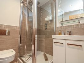 A bathroom with a shower and sink at Tornado @ Engine Shed in Whitby