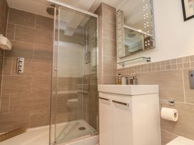 A bathroom with a shower and sink at Tornado @ Engine Shed in Whitby