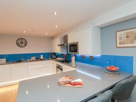 A kitchen with a countertop, sink, and oven at Blue Peter @ Engine Shed in Whitby