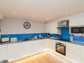 A kitchen with countertops, sink, microwave and appliances at Blue Peter @ Engine Shed in Whitby