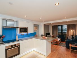 A kitchen with a stove and microwave at Blue Peter @ Engine Shed in Whitby