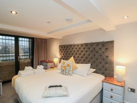 A bedroom with a bed and bedside tables at Blue Peter @ Engine Shed in Whitby