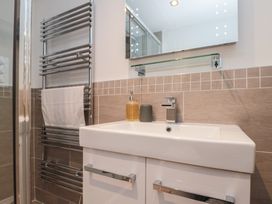 A bathroom with sink and towel rail at Blue Peter @ Engine Shed in Whitby