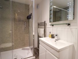 A bathroom with a shower and sink at Blue Peter @ Engine Shed Whitby