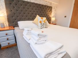 A bedroom with a bed and towels at Olton Hall @ Engine Shed, Whitby