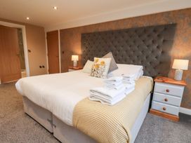 A bedroom with a bed and bedside tables at Olton Hall @ Engine Shed in Whitby