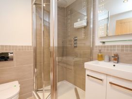 A bathroom with a shower, sink and toilet at Olton Hall @ Engine Shed in Whitby
