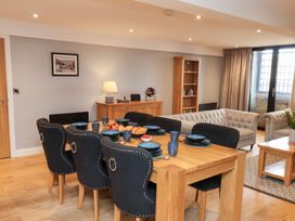 A dining room with a table set for dinner at Mallard @ Engine Shed in Whitby