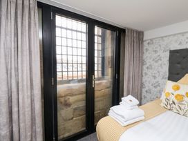 A bedroom with a bed and window at Mallard @ Engine Shed Whitby