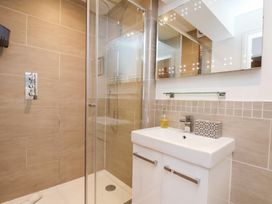 A bathroom with a shower and sink at Mallard @ Engine Shed in Whitby