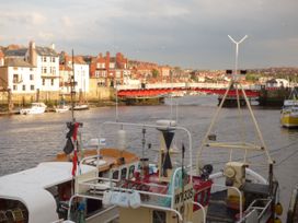 A view of boats and buildings near a bridge at Mallard @ Engine Shed Whitby