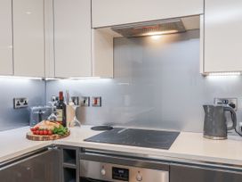 A kitchen with a cooking hob and food items at George Stephenson @ Engine Shed in Whitby