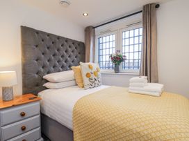 A bedroom with a bed and pillows at George Stephenson @ Engine Shed, Whitby