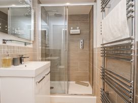 A bathroom with a shower and a sink at George Stephenson @ Engine Shed in Whitby