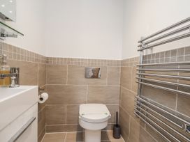 A bathroom with a toilet and sink at George Stephenson @ Engine Shed in Whitby