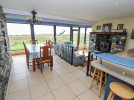 A dining area with a table and chairs at Ocean Sail House Termon near Dungloe County Donegal