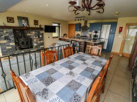 A dining room with a table and chairs at Ocean Sail House in Termon near Dungloe, County Donegal