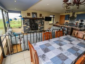 A dining room with a table and chairs at Ocean Sail House Termon near Dungloe County Donegal