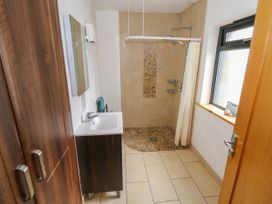 A bathroom with a wash basin and shower at Ocean Sail House, Termon near Dungloe, County Donegal