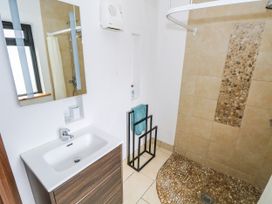 A bathroom with a shower and sink at Ocean Sail House in Termon near Dungloe, County Donegal