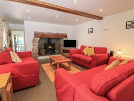 A living room with sofas and a fireplace at Dale Barton in Wells