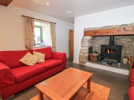 A living room with a sofa and fireplace at Dale Barton in Wells