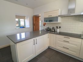 A kitchen with countertop, kettle, and cabinets at Dale Barton in Wells